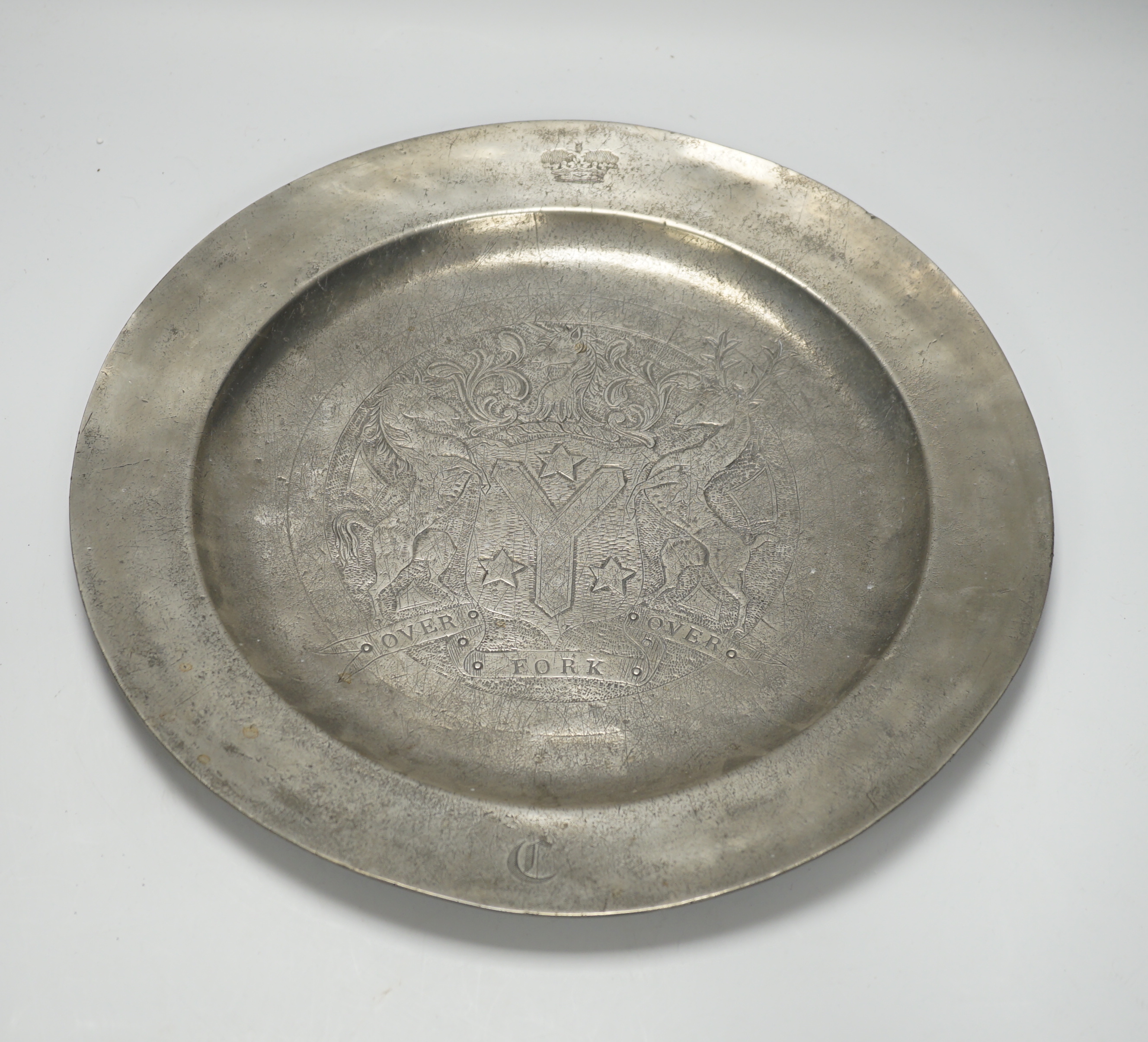 An 18th century pewter armorial charger, 38cm diameter